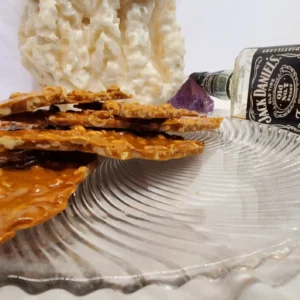 Jack Daniels and Johnny Walker Black label are used to make this peanut brittle and you can taste it!